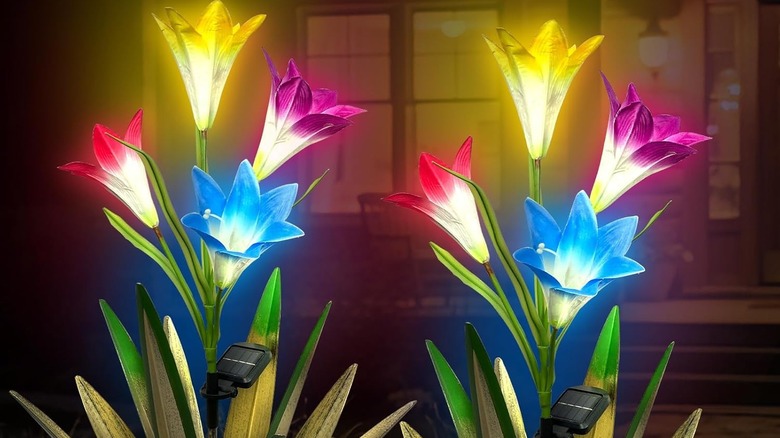 Homight's Metal Agave Lily Sculpture in a garden setting at night