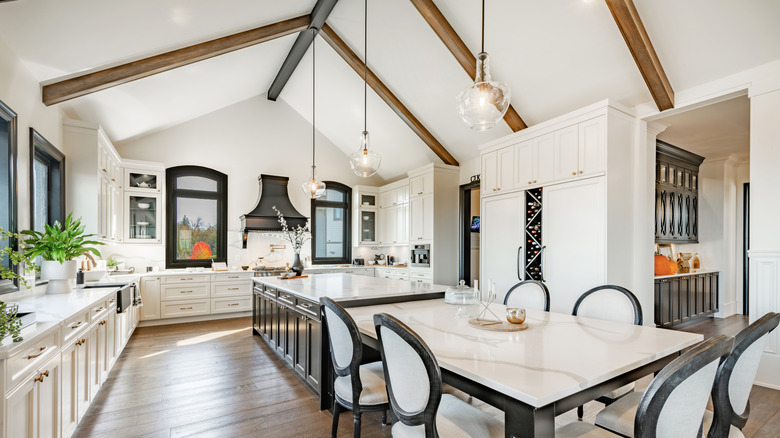 A beautiful kitchen with wood beams along the ceiling