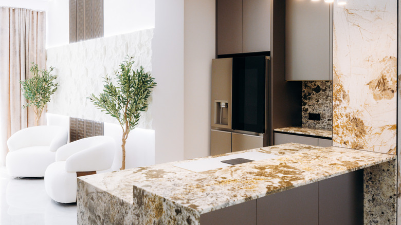 A kitchen with strikingly-patterned natural stone