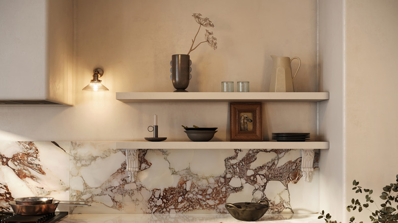 Open shelving used in a kitchen to display a curated selection of decorative items