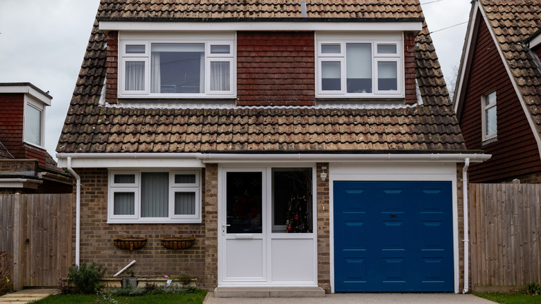 A small two-story home with an attached garage