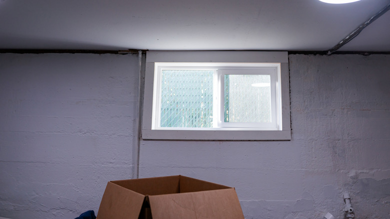 A small window in the basement of a home