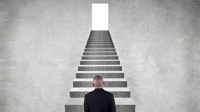 A man looking at stairs