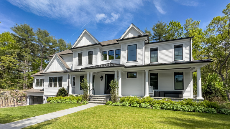 Contemporary home with clean white siding