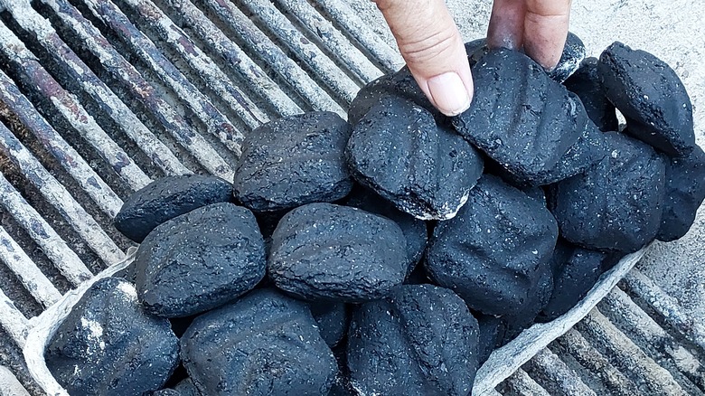 Charcoal in egg carton on grill