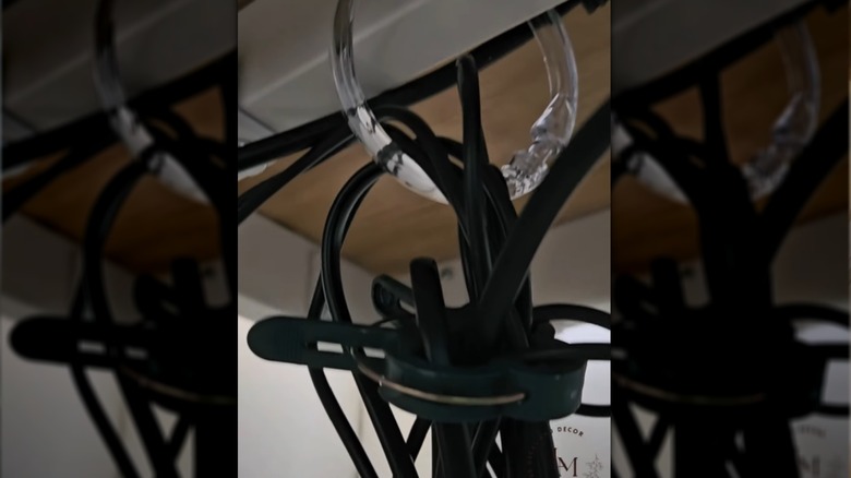 A shower curtain ring used to organize cords