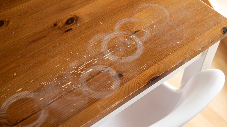 White cup stains on wooden table