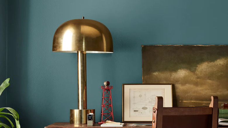 Wall painted in Magnolia's Weekend behind a desk and a lamp
