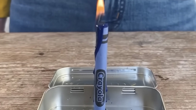 Blue crayon on fire