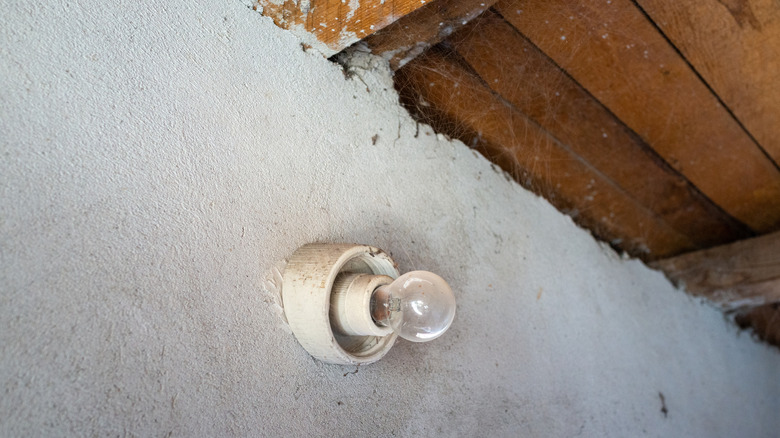 Exposed bulb low on ceiling