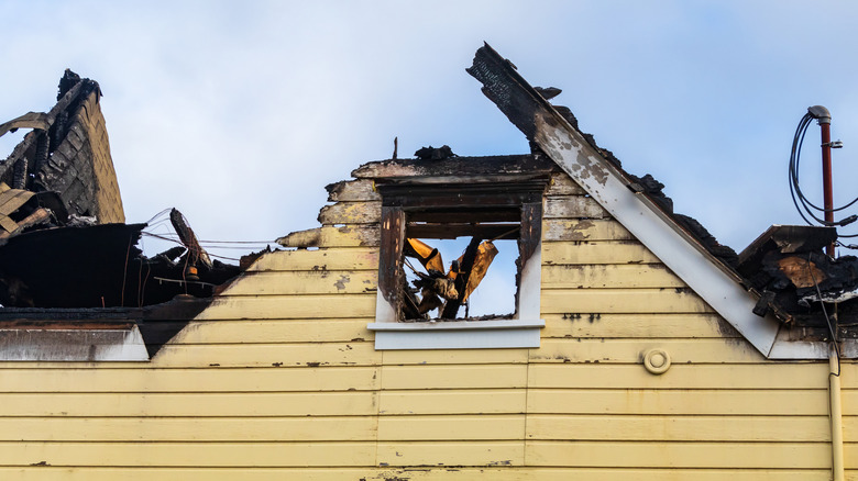 A house with fire damage at the roof