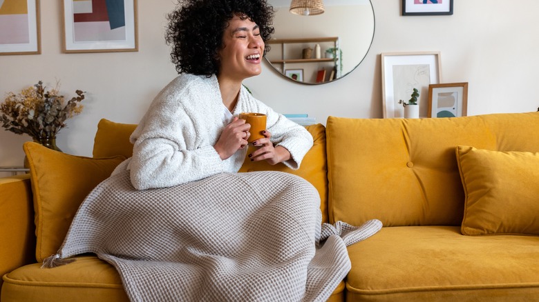 Person with throw blanket