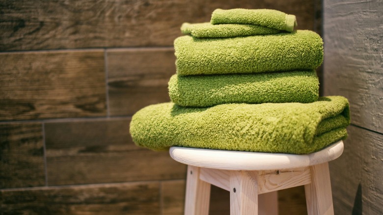 green towels on stool