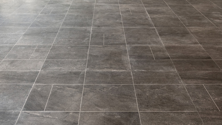A close-up shot of a gray marble tile floor