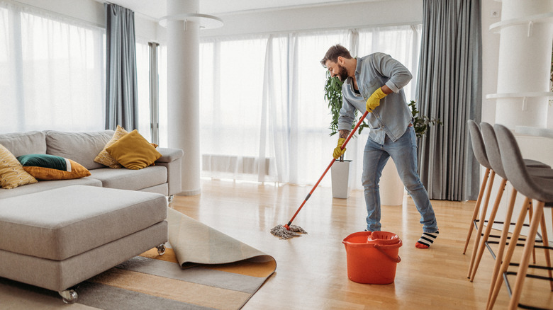 A person mopping floors