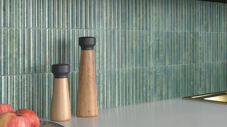 close up of green fluted tile backsplash in kitchen