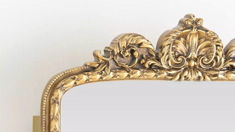 Top left corner and top detailing of Anthropologie Gleaming Primrose Medicine Cabinet
