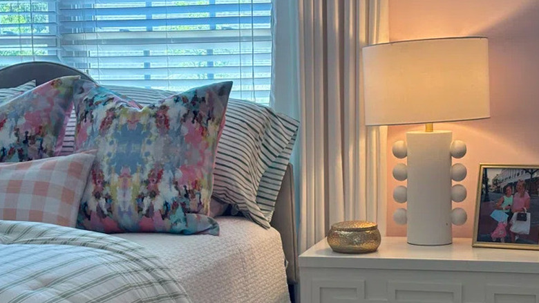 White Memphis-style lamp on nightstand