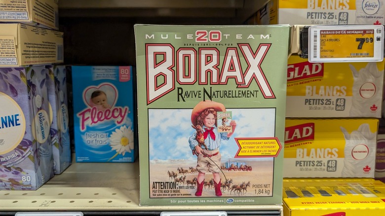 A box of borax in a store, near trash bags and dryer sheets