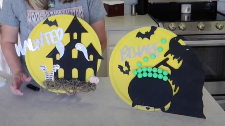 woman making DIY Halloween signs