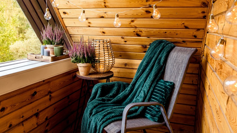Gray chair facing cabin window