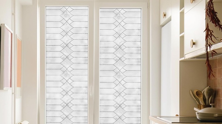A beautiful kitchen with a decorative glass window film on the window