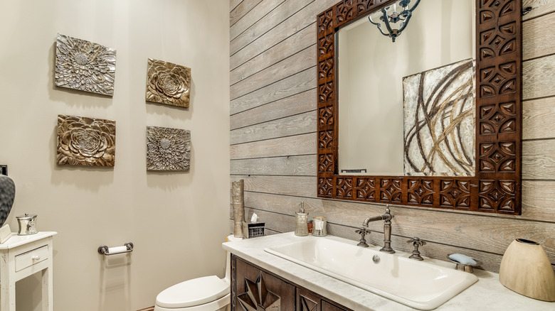 a shiplap accent wall in a bathroom behind the sink