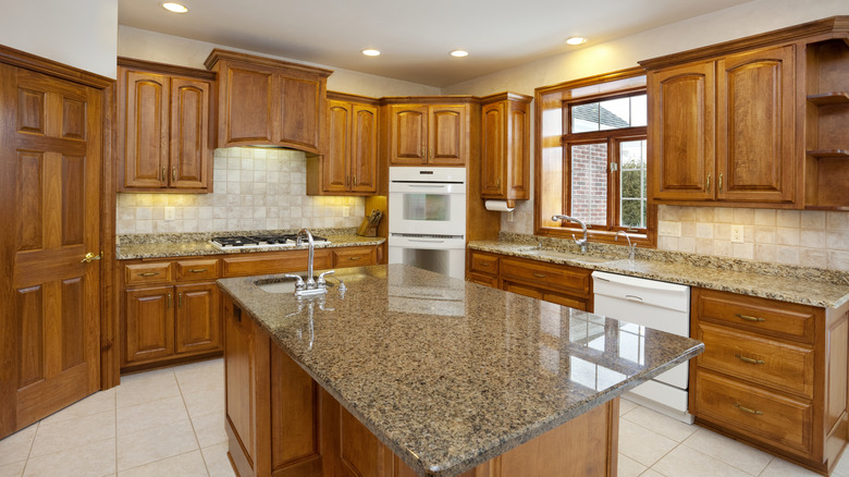 Dated honey oak cabinets in a kitchen