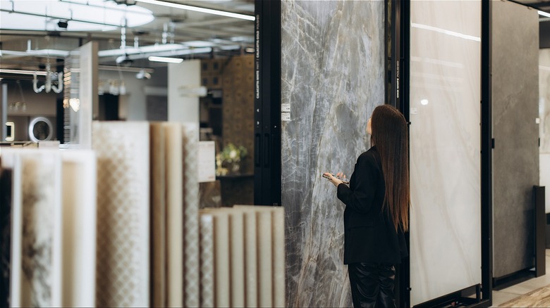 A woman shopping for stone slabs