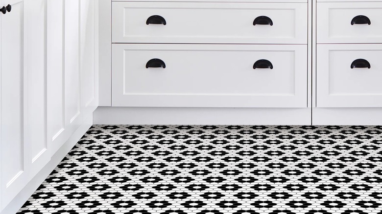 Black and white vinyl tile flooring in a kitchen