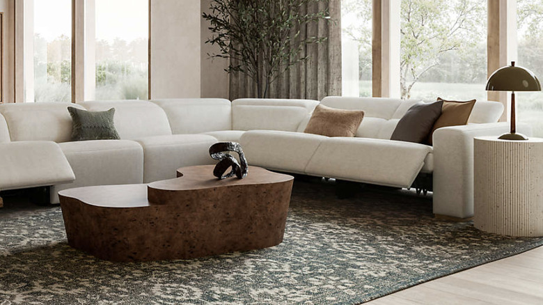 A living room with a white sectional recliner couch made from Crypton fabric