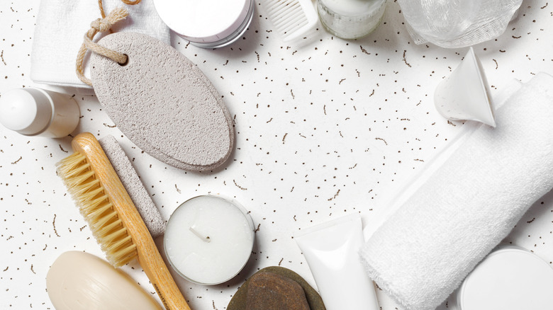 assorted bath products on a white speckled countertop