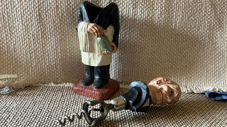 A vintage Syroco corkscrew that looks like a butler