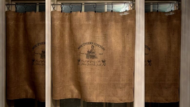 Burlap bags hung as window curtain