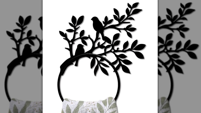Product image of black towel holder decorated with birds and vines, on white background