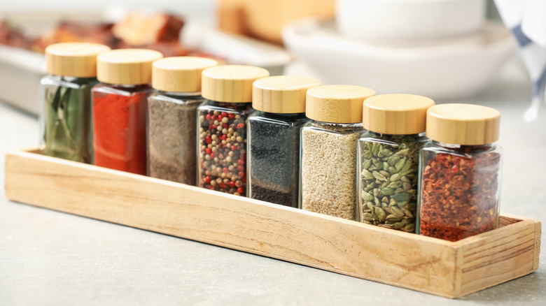 Spices in a low wooden box for organizing