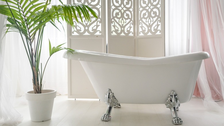 White bathtub with chrome feet