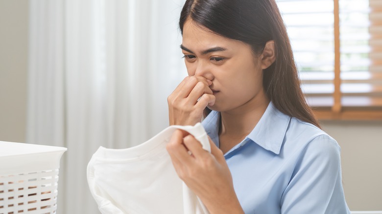 person making foul face to her shirt