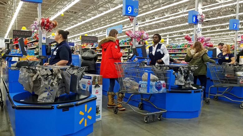 people at walmart checkout lanes