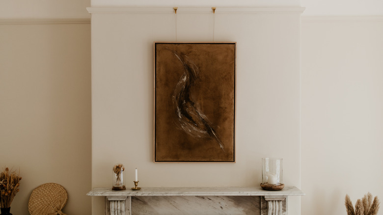 art hanging above mantle