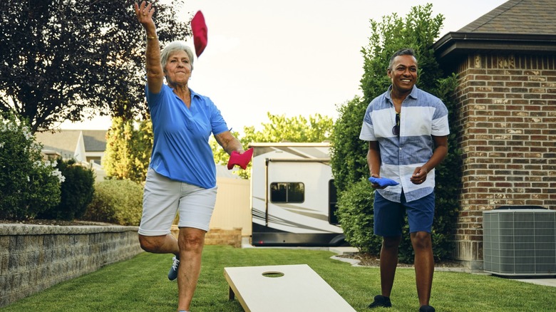 people playing cornhole