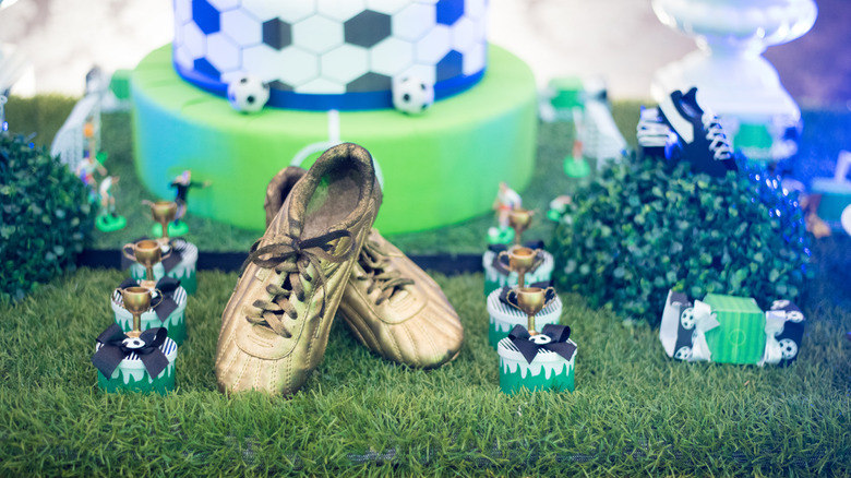 soccer themed tablescape with trophies