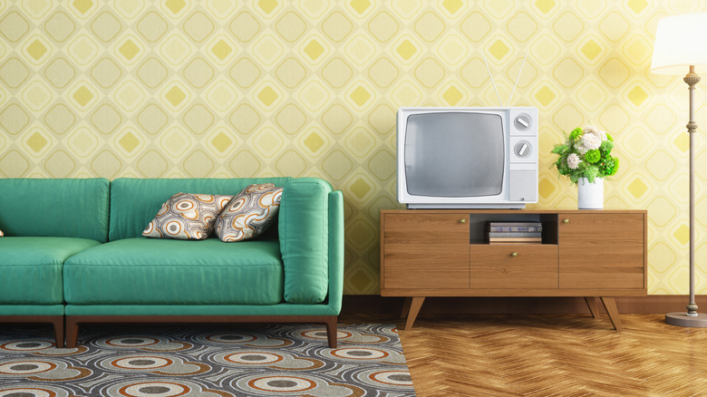 Vintage living room decorated with geometric shapes and bright colors of the '60s.