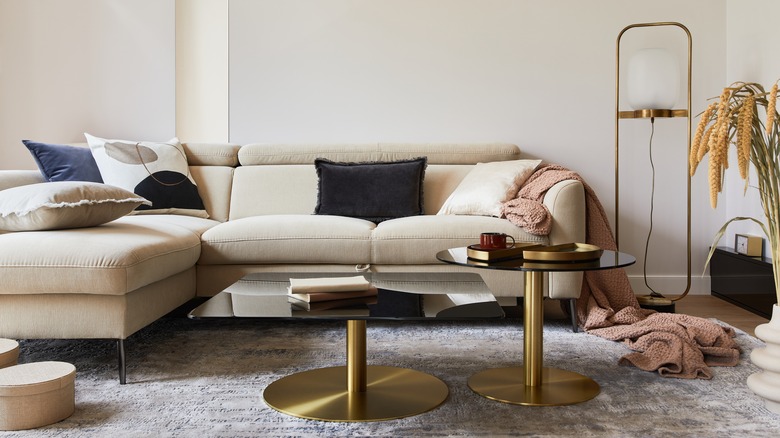 beige couch gold side table