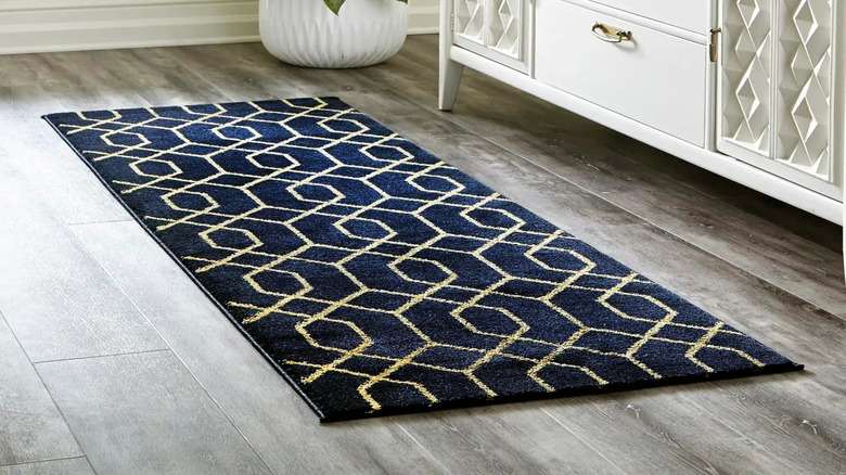 Textured rug, cabinet doors, wall mould and plants