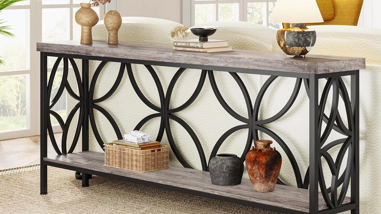 Slender table behind couch