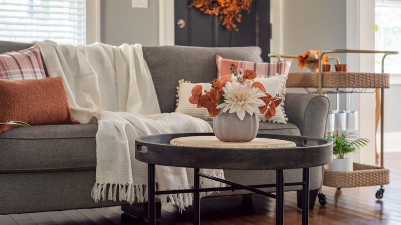 Wheeled cart next to a sofa