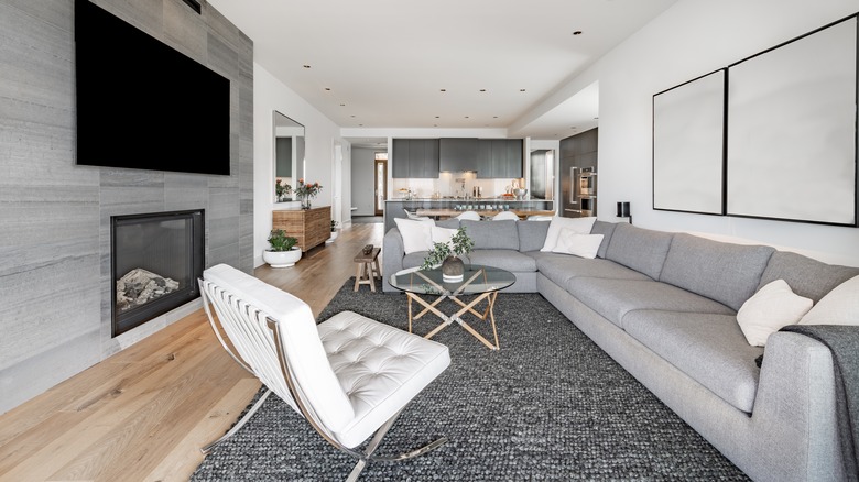 Contemporary condo living room with gray sectional sofa