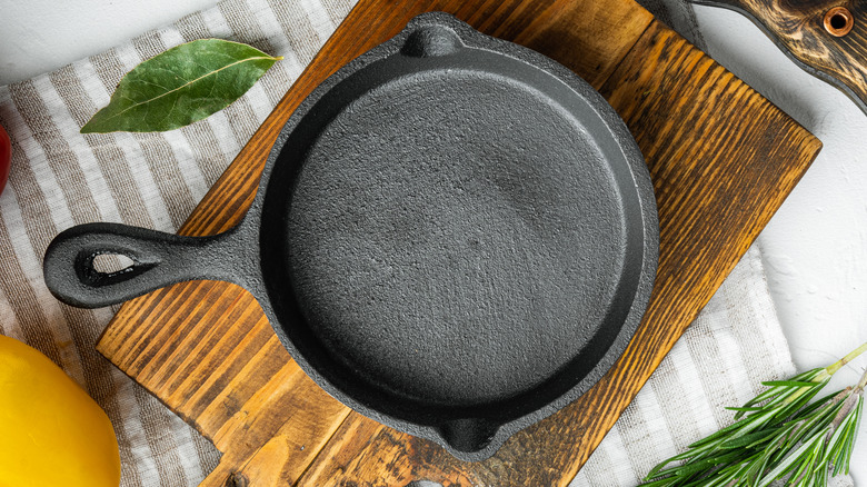 Cast iron skillet on a wood cutting board