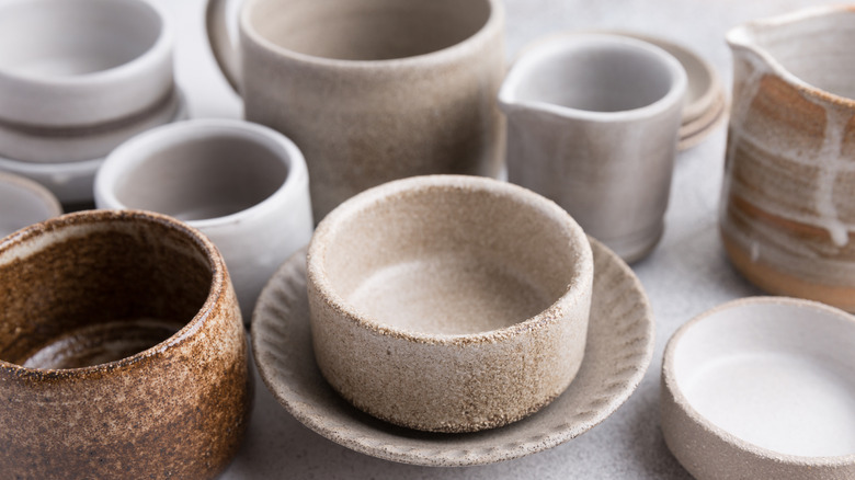 A variety of ceramic bowls and dishware on a table